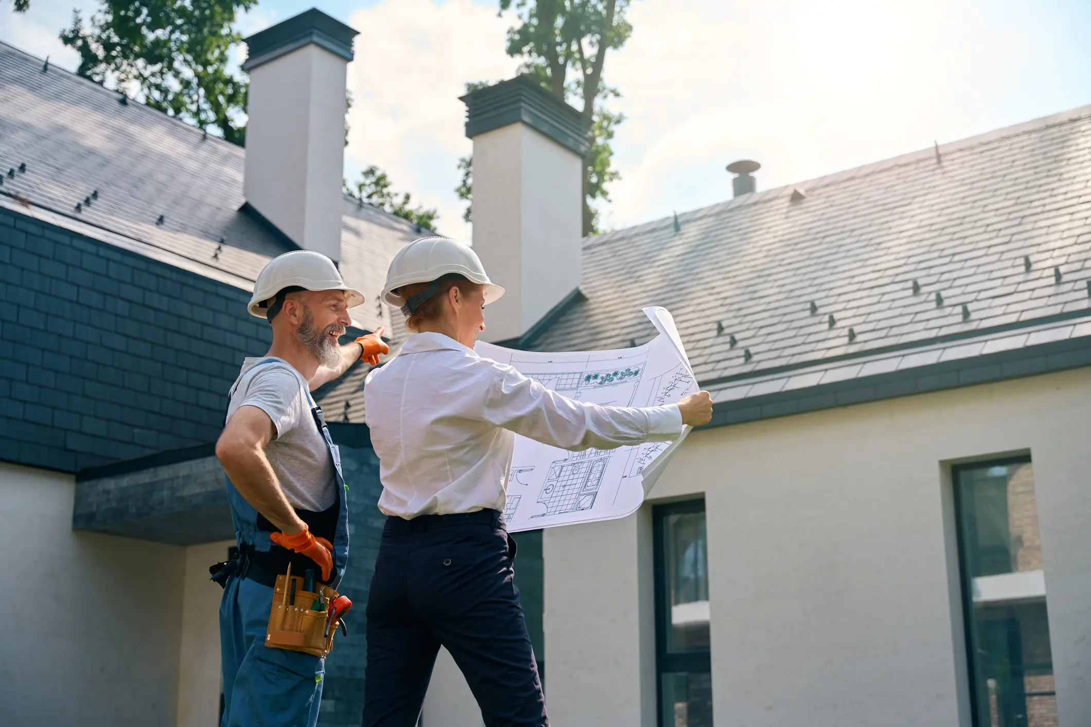 Two people working on roof safety for a residence.