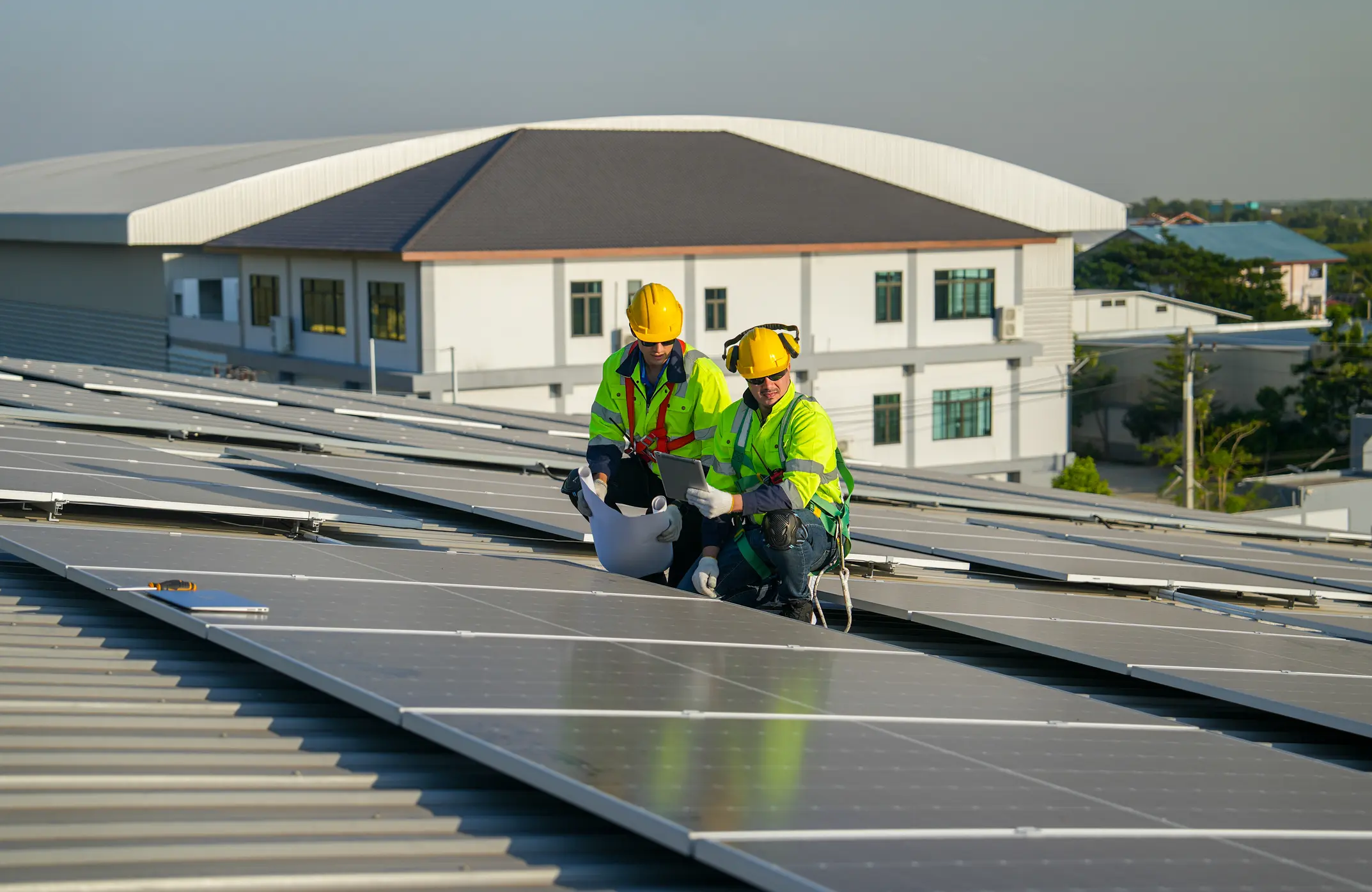 Engineers inspecting solar panel installation